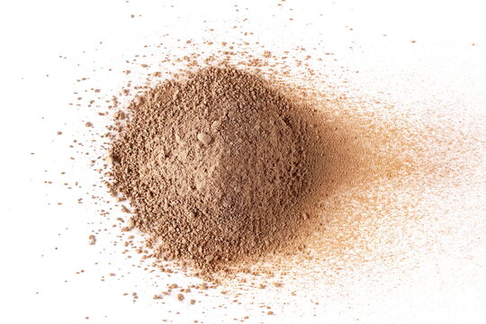 Chocolate ground, pile powder scattered, isolated on white background, top view, clipping path
