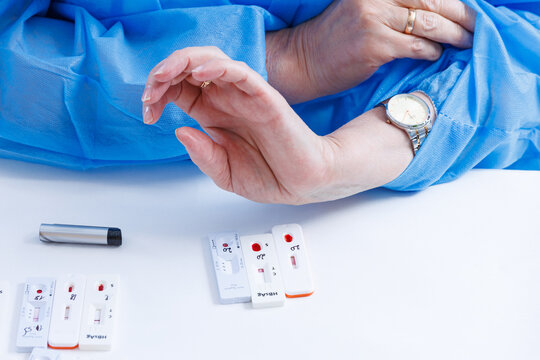 Doctor hands waiting for rapid express test cassette results for HIV and hepatitis