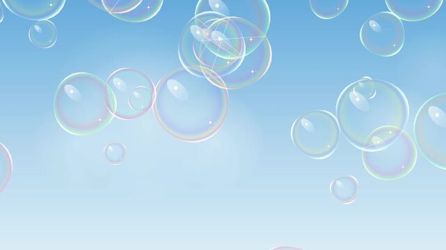 Many colorful soap bubbles floating in the air on a light blue background