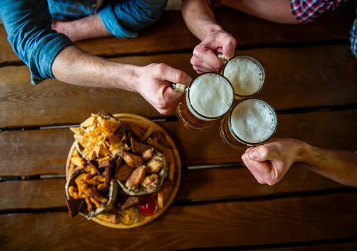 Friends Toasting Beer Together.