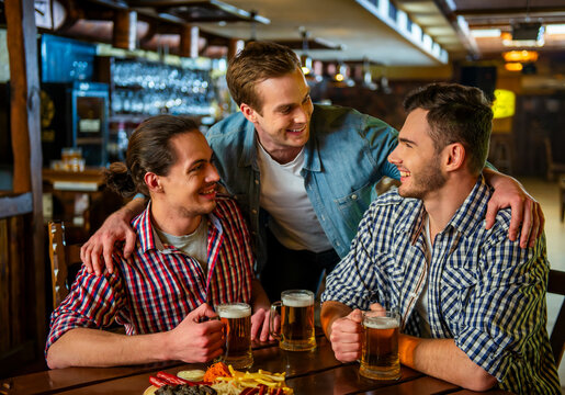 Friends Enjoying Beer Together.