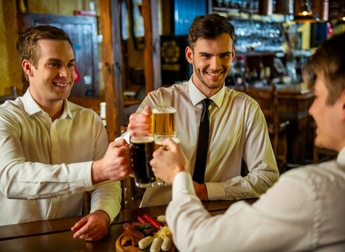 Business Colleagues Toasting Beer.