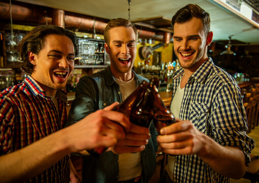 Friends Toasting Bottles.