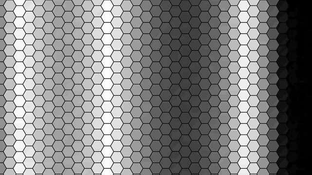 Abstract geometric pattern with monochrome hexagonal shapes in a gradient transition from dark to light grey tones