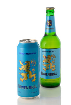 August 10, 2026, Tbilisi, Georgia A studio product shot of a blue aluminum can and a green glass bottle of L&ouml;wenbr&auml;u M&uuml;nchner Hell lager beer, positioned together with the can slightly in the