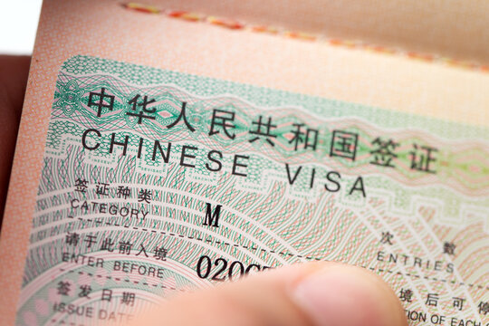 Republic of China entry visa stamp inside an open passport. Useful image for international travel, Chinese immigration, travel documents, and border control topics