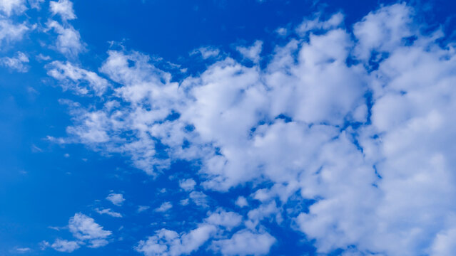 Blue with white clouds. Beautiful photo of heaven in high quality. Stock image of clouds.