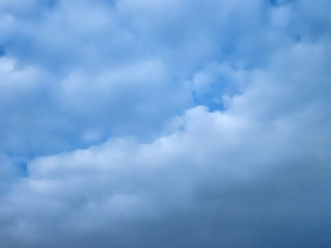White clouds in the blue sky.
