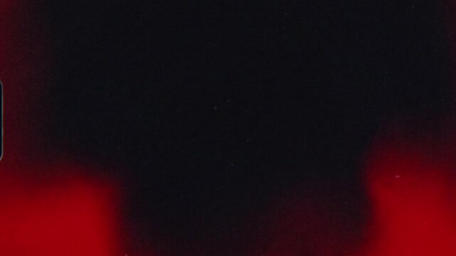 4k Film Grain Effect with Light Burns filmed with 8mm Camera for Documentary Use