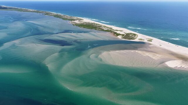 The North Atlantic Ocean washes against the beautiful coast of Chatham on Cape Cod, Massachusetts. This outer Cape is a popular east coast vacation destination during summer months.