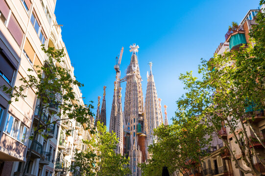 Barcelona, Spain - April 15, 2026: This year, iconic Sagrada Fam&iacute;lia church has finally been completed in height, with large white cross placed on top of it.