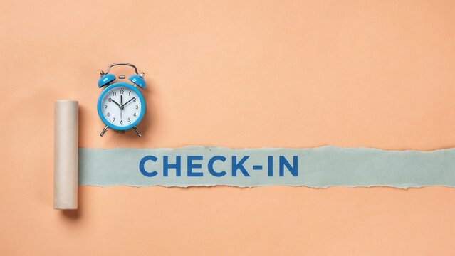 Check-in text on torn paper with blue alarm clock on peach background