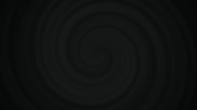 Monochromatic dark spiral pattern rotates in a continuous loop