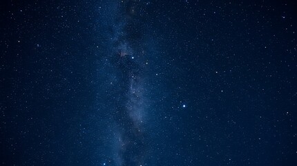Obraz premium Starlit night sky with bright stars and Milky Way galaxy in deep blue space background.