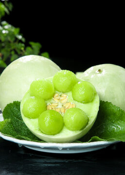 Fresh Green Melon Balls in Melon Bowls with Mint Garnish - Shandong Style Fruit Presentation