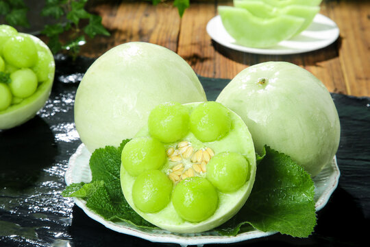 Fresh Jade Green Shandong Melons with Mint on Wooden Table - Chinese Produce Display
