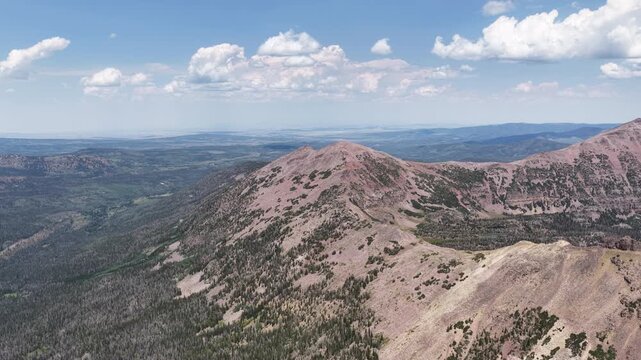 High aerial of Uinta Wasatch Cache National Forest mountain landscape in Utah with exposed and steep slopes and ridge lines in summer