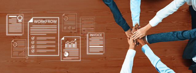Obraz premium Team Collaboration and Workflow Management with Hands Over Documents on a Wooden Table in a Professional Office Setting. Bitwise.