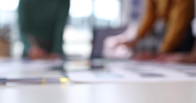 Design team collaborating on user experience and interface development, prototyping mobile application layouts