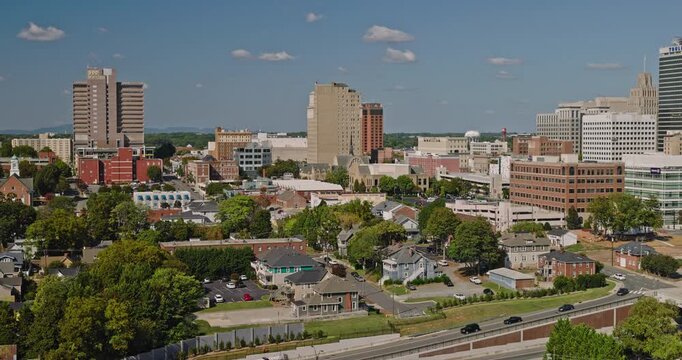 Winston-Salem North Carolina Aerial v4 low flyover across downtown with office towers, streets and surrounding neighborhoods - Shot with 8k Camera - Oct 1st 2023