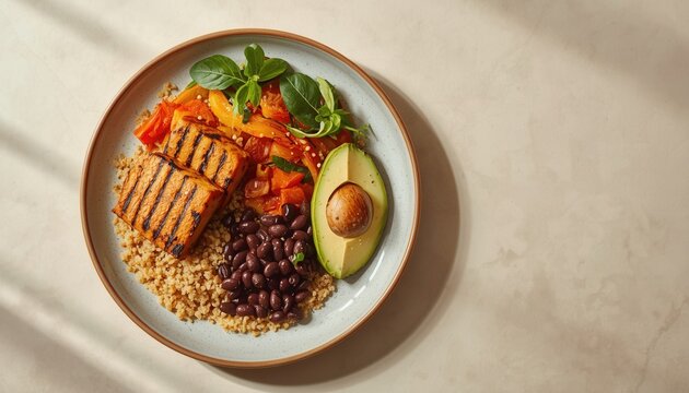 Healthy Tofu Bowl with Avocado and Black Beans: A vibrant and nutritious bowl featuring grilled tofu, fluffy quinoa, black beans, and fresh avocado, artfully arranged and garnished with herbs.