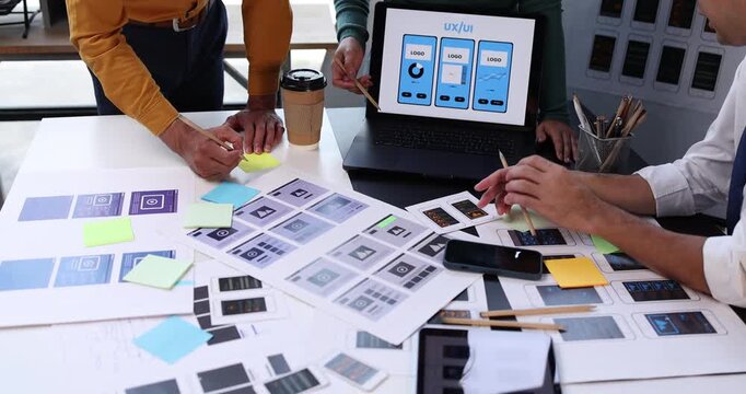 Design team hands actively working on ui ux design, planning and prototyping responsive web and mobile application development