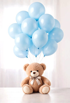 Cute brown teddy bear holding a bunch of light blue balloons for celebration or baby shower decoration idea