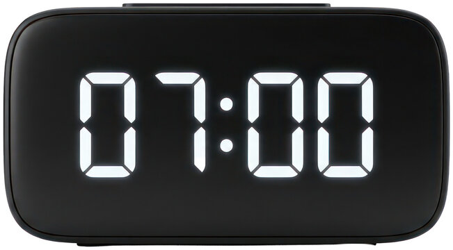 Digital alarm clock showing seven o'clock on black background
