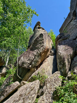 Photo of rocks in the forest on a mount Tserkovka near the Altai resort of Belokurikha.
