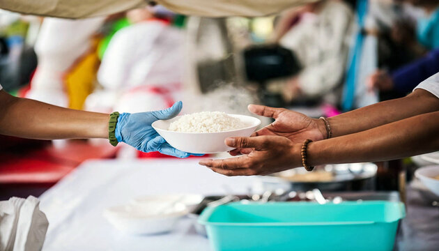 Volunteer hand in glove sharing hot food bowl to poor homeless person, charity donation community kitchen service concept, hunger relief social support and poverty assistance banner