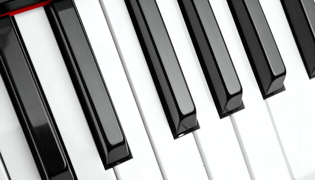 Piano keys close-up showing black and white keys at an angle