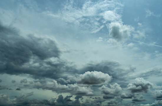 Moody gray cloudscape with textured storm clouds across the horizon, natural weather background for climate, meteorology, environmental concepts, forecast, rain and dramatic atmosphere.