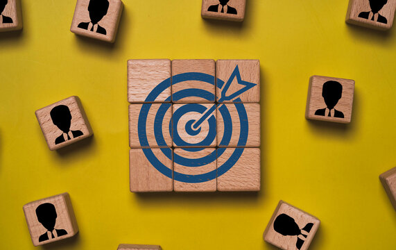 Business target with arrow and people icons symbolizes goal achievement strategy, leadership with teamwork to success performance, workforce management, planning and organizational growth concept.