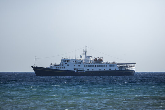 Zakinthos, Greece - 01 August 2026: View of a passenger ferry sailing on the deep blue sea under a clear sky.