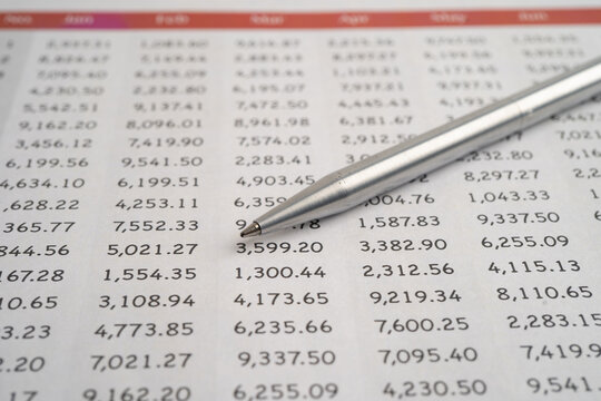 Pen on spreadsheet and graph paper.