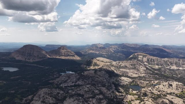 Aerial of Uinta Wasatch Cache National Forest rugged mountains and alpine lakes in Utah with rolling peaks and ridges in summer