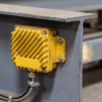 Industrial rfid reader and asset tracking sensor mounted on a steel beam for warehouse automation hardware