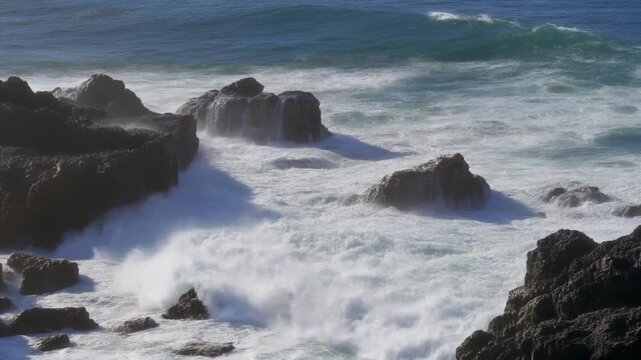 Powerful ocean waves splashing over Biscoitos natural pools