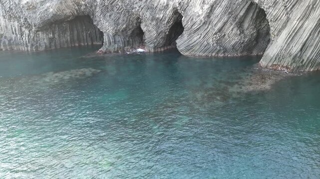 Nanatsugama Cliffs in Saga, Japan &mdash; Dramatic Aerial Drone View of Basalt Sea Cliffs and Caves on the Genkai Sea