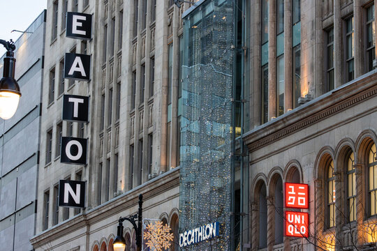 MONTREAL, CANADA, 22 December 2025 : Downtown shopping signs city architecture buildings urban scene