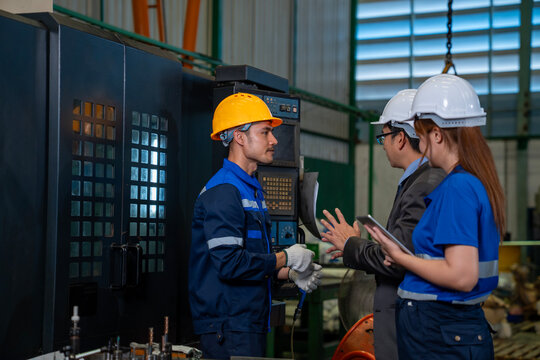Team of diversity worker inspecting inside steel manufacturing factory while listening to senior manager advice on improvement of capacity and productivity