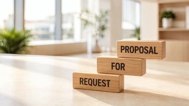 Business Proposal Steps: Wooden blocks on a desk spell out REQUEST FOR PROPOSAL, symbolizing the initial stages of a business venture or project initiation.