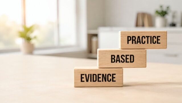 Evidence Based Practice Wooden Blocks: Wooden blocks stacked to form a staircase with the words EVIDENCE, BASED, and PRACTICE inscribed on them, symbolizing progress and knowledge application.