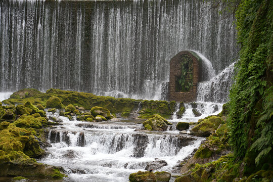 Waterfall and mossy rocks at Libo Xiaoqikong Scenic Area, Guizhou, China