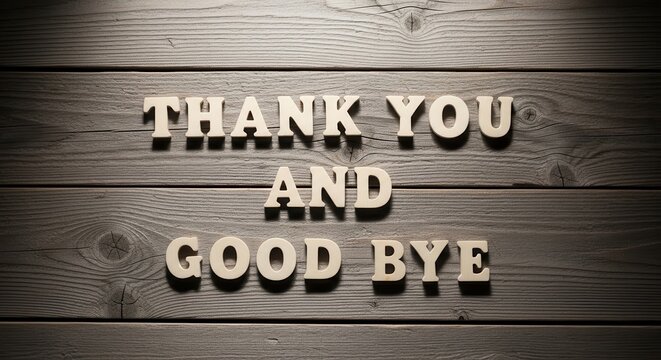 "Thank You and Good Bye" text in wooden letters on a rustic dark wood background with warm lighting.