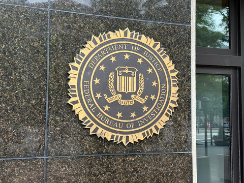 Federal Bureau of Investigation seal mounted on a dark stone building exterior - Washington, District of Columbia, USA - July 28, 2026
