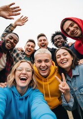 Fototapeta premium Diverse Group of Happy Young Friends Taking a Group Selfie Outdoors, Smiling and Laughing Together