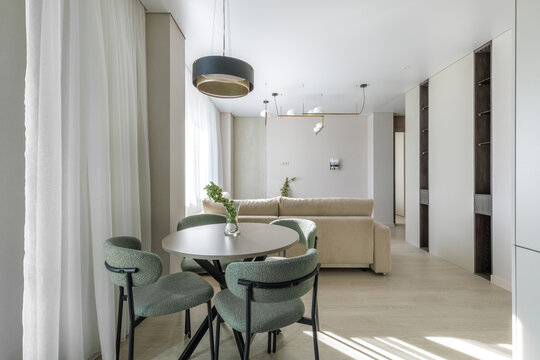 Modern Open-Plan Apartment Interior with Dining and Living Zones