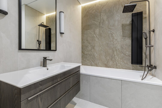 Modern Bathroom Vanity and Bathtub Area Interior View