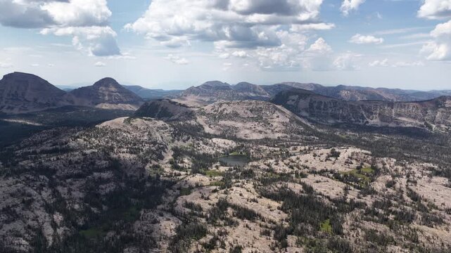 High aerial of Uinta Wasatch Cache National Forest rugged mountains and alpine lakes in Utah in summer